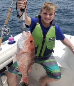 Kid holding fish