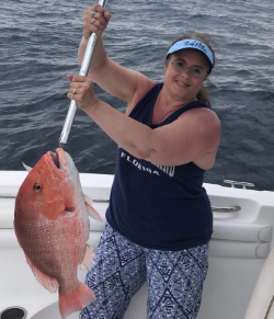 Woman holding a snapper